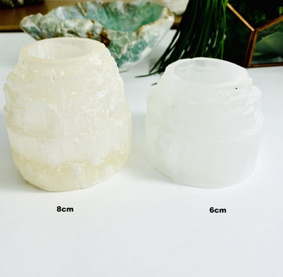 both selenite tower candle holder sizes on display for size comparison
