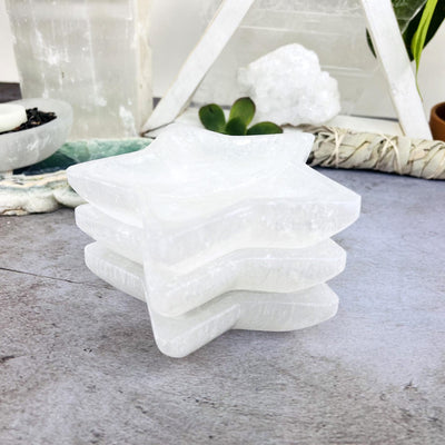 3 Selenite Star Bowls Stacked up from side view 