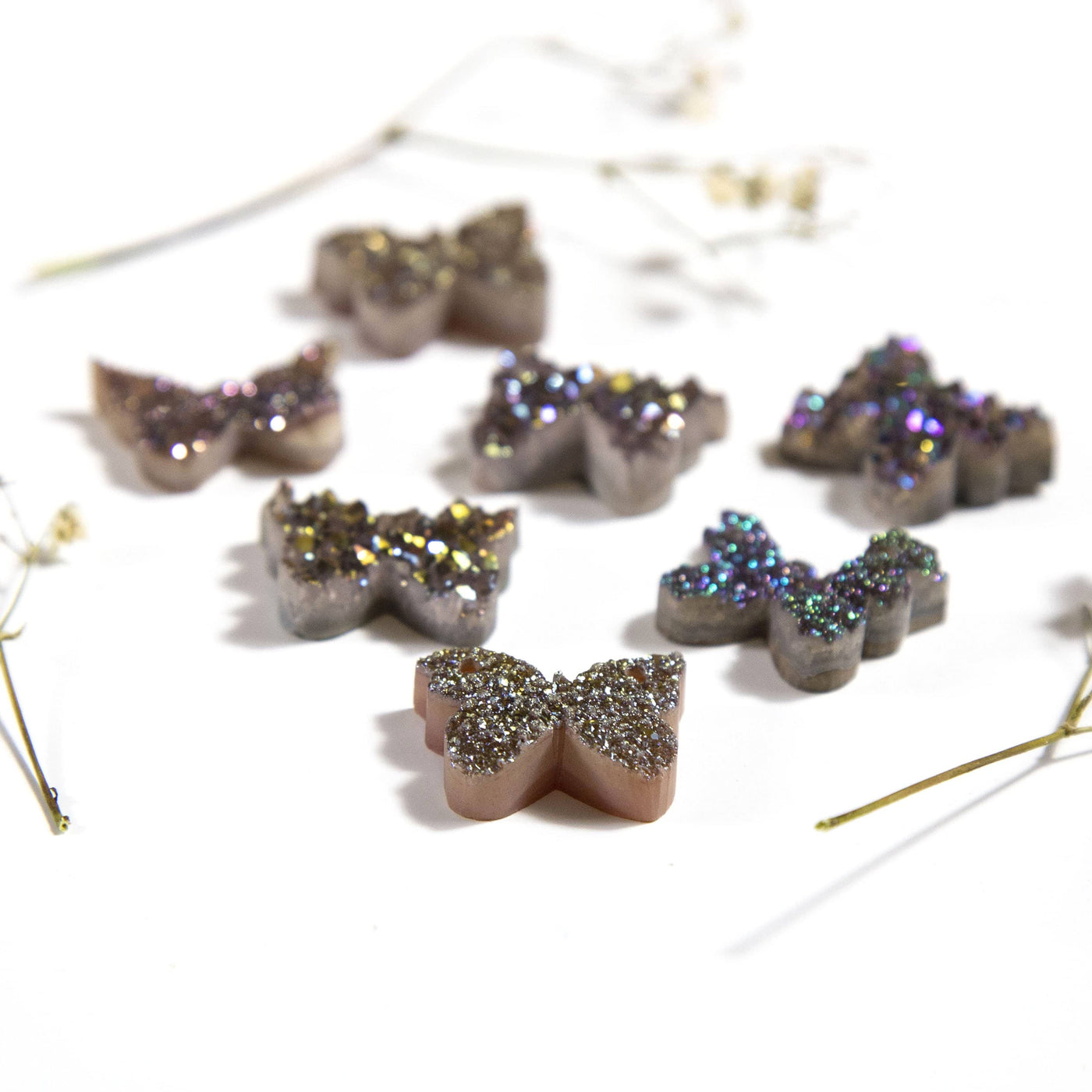 side view of the Double top drill Titanium Rainbow Druzy Butterfly Cabochons for thickness reference