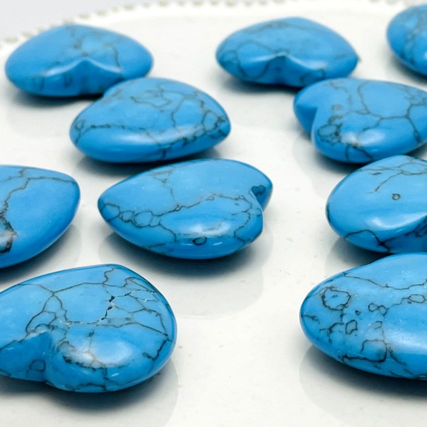Turquoise Howlite Hearts from the side showing thickness