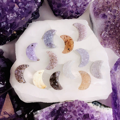 Front facing Agate Druzy Moon Cabochons (RK134B4) displaying color variation in an alter with a white background.