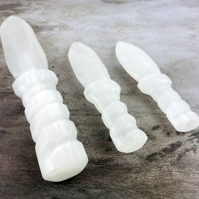 3 sizes of Selenite Knife with Twisted Handles at an angle