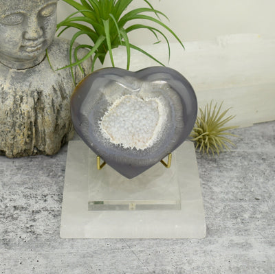 Front facing view of Agate Druzy Heart - OOAK - (DOOAK-S24-02) in a stand within an alter.
