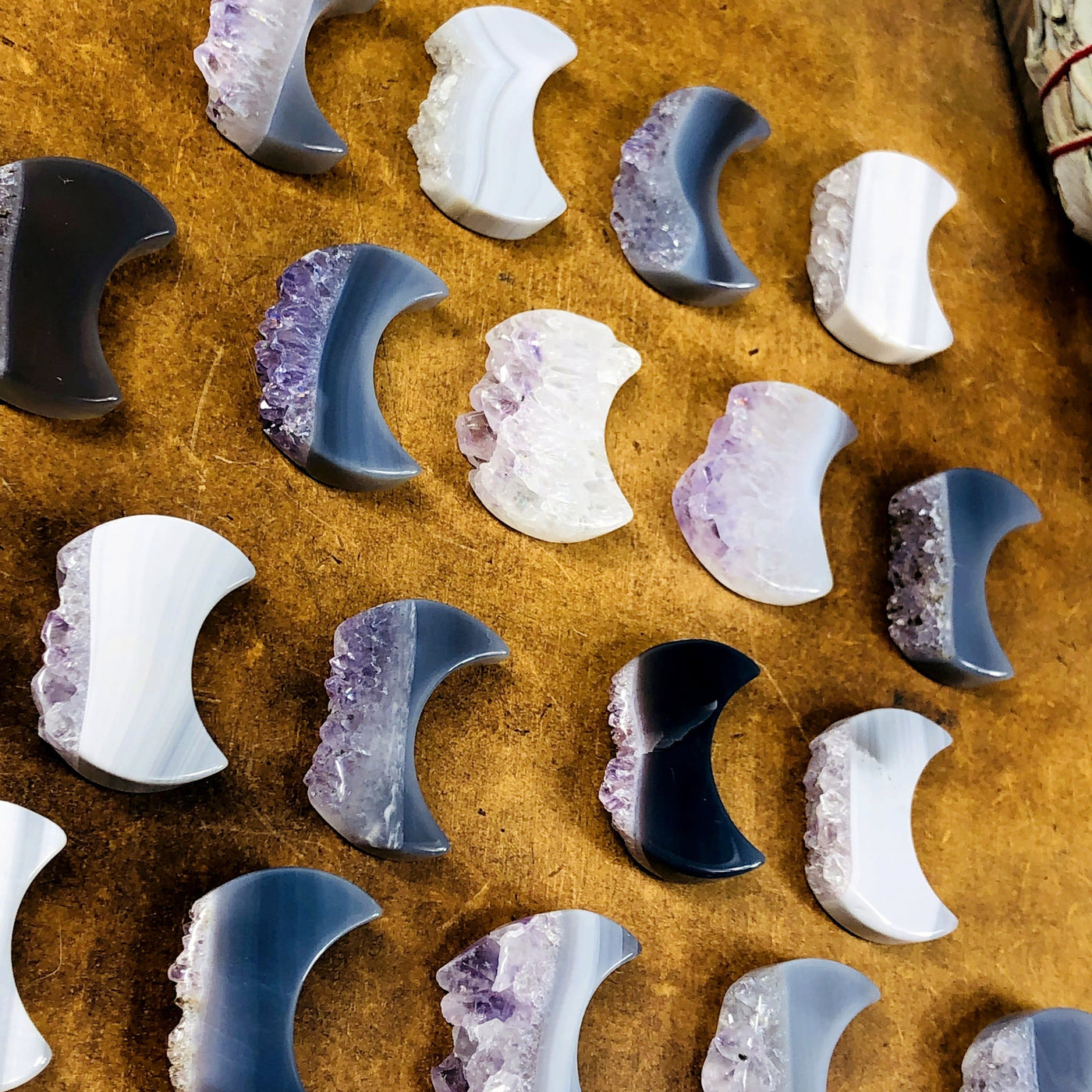 side shot of amethyst moon slices showing the different thicknesses 