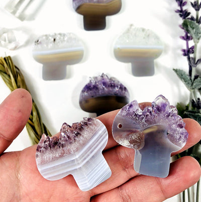 Amethyst Mushroom Shaped Large Cabochons with 2 in a hand for size reference, showing drilled and undrilled