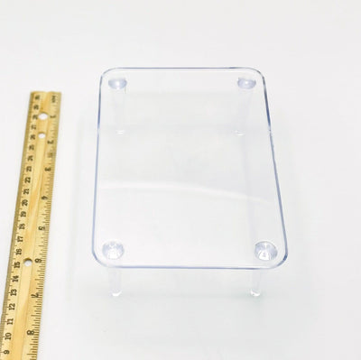 crystal display stand next to a ruler for size reference 