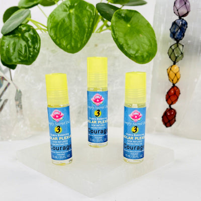 3 Simply Sacred Oil Solar Plexus Chakra Balancing Oil displayed to show bottles on white background