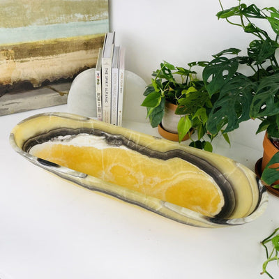 Mexican Onyx Oval Bowl on display from a side angle