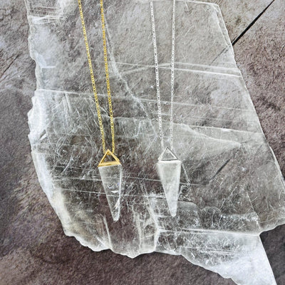 Crystal Quartz Pendulum Necklaces in gold and silver up close