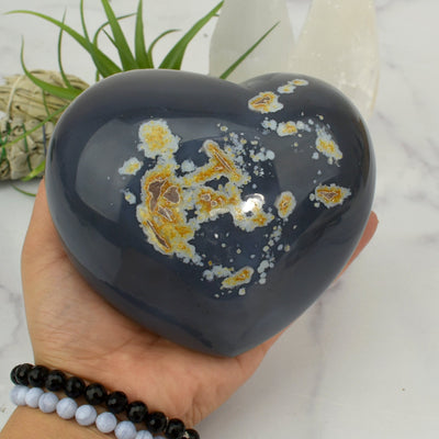 Back side view of Agate Druzy Heart - OOAK - (DOOAK-S24-03) in a hand.