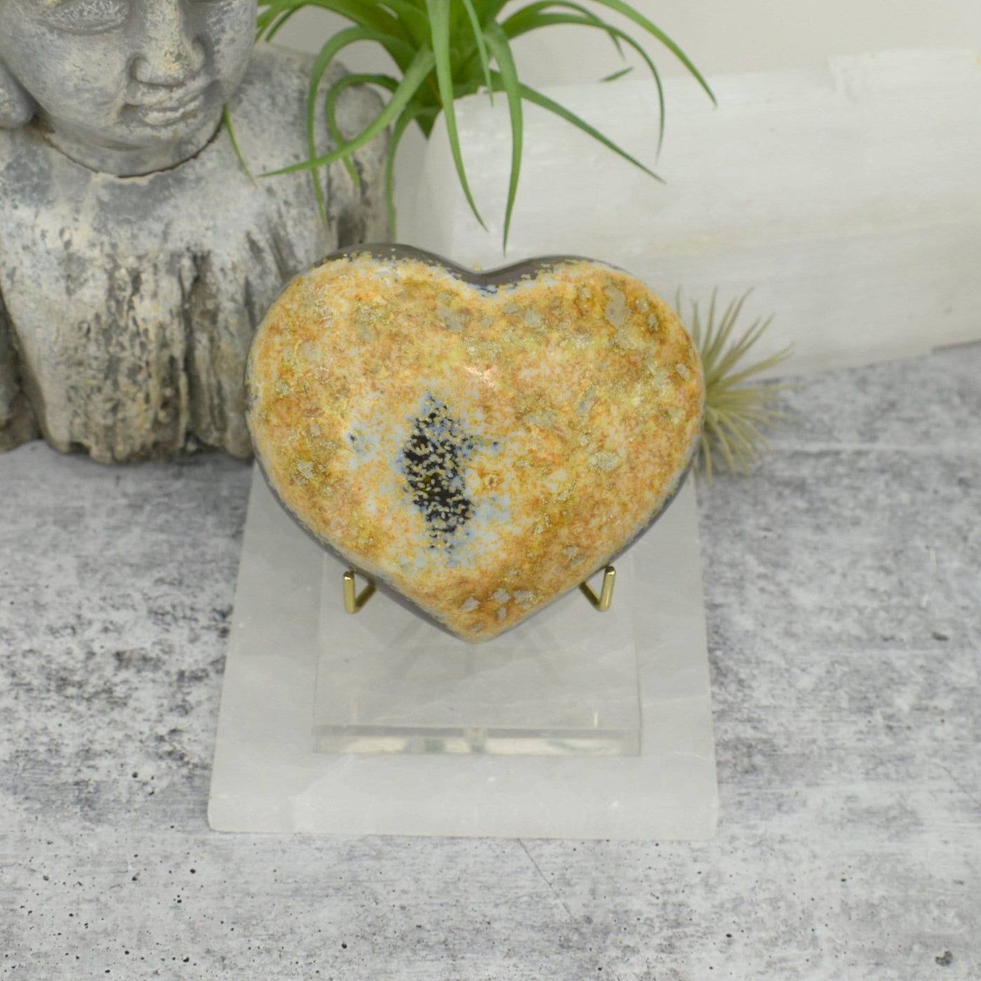 Back view of Agate Druzy Heart - OOAK - (DOOAK-S24-02) in a stand within an alter.