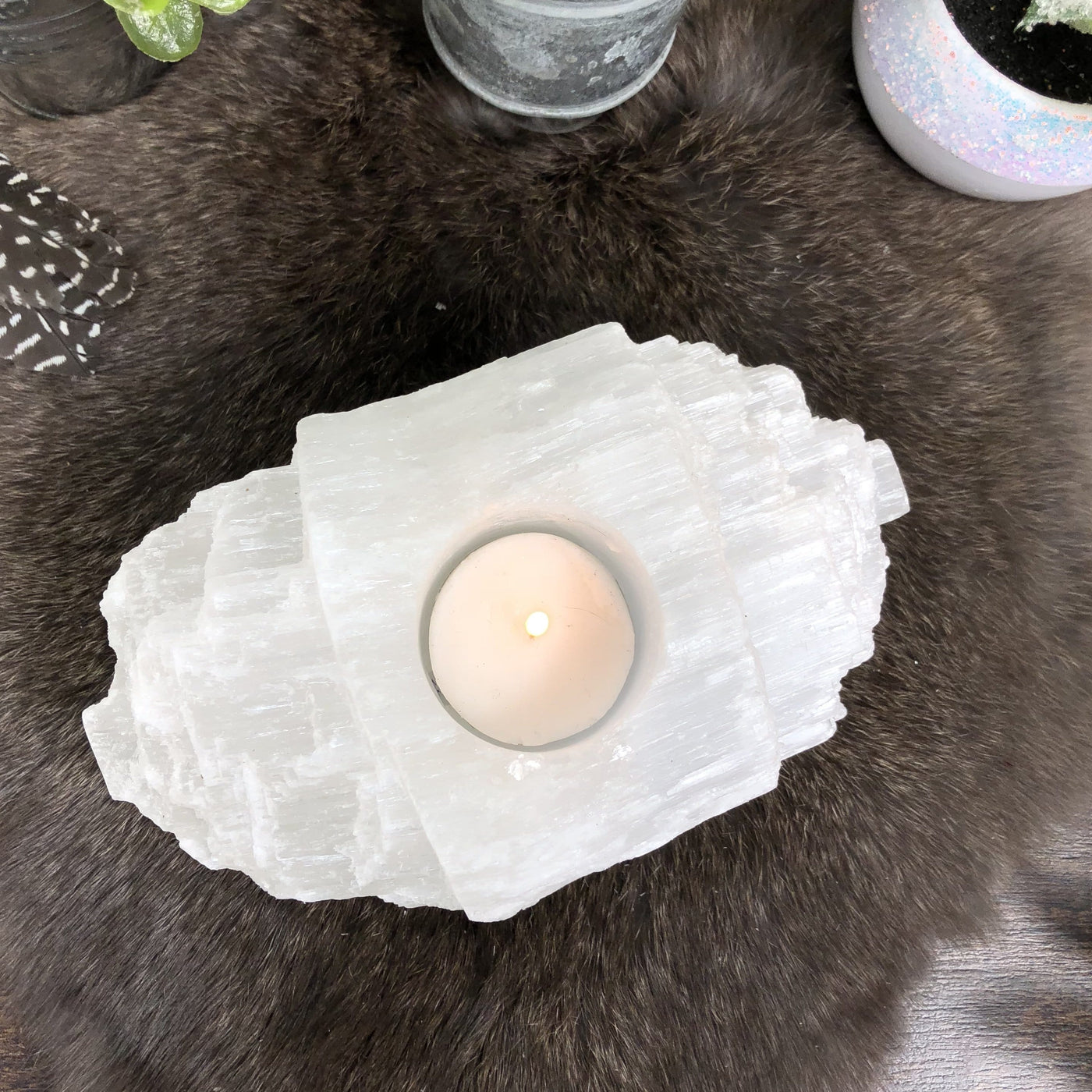 overhead view of selenite log candle holder with candle (not included with purchase)