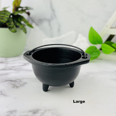 Black Cauldrons with Handles - Cauldron Set of 3 - large shown on a table