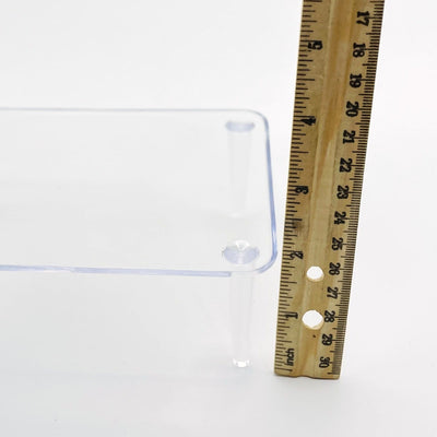 crystal display stand next to a ruler for size reference