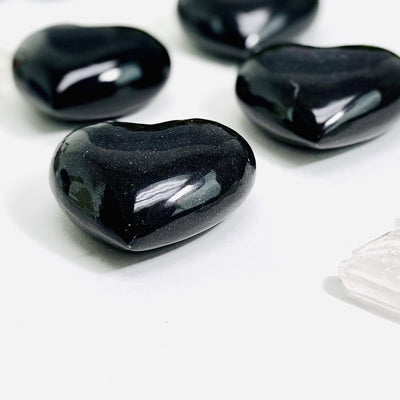 side view of black onyx hearts