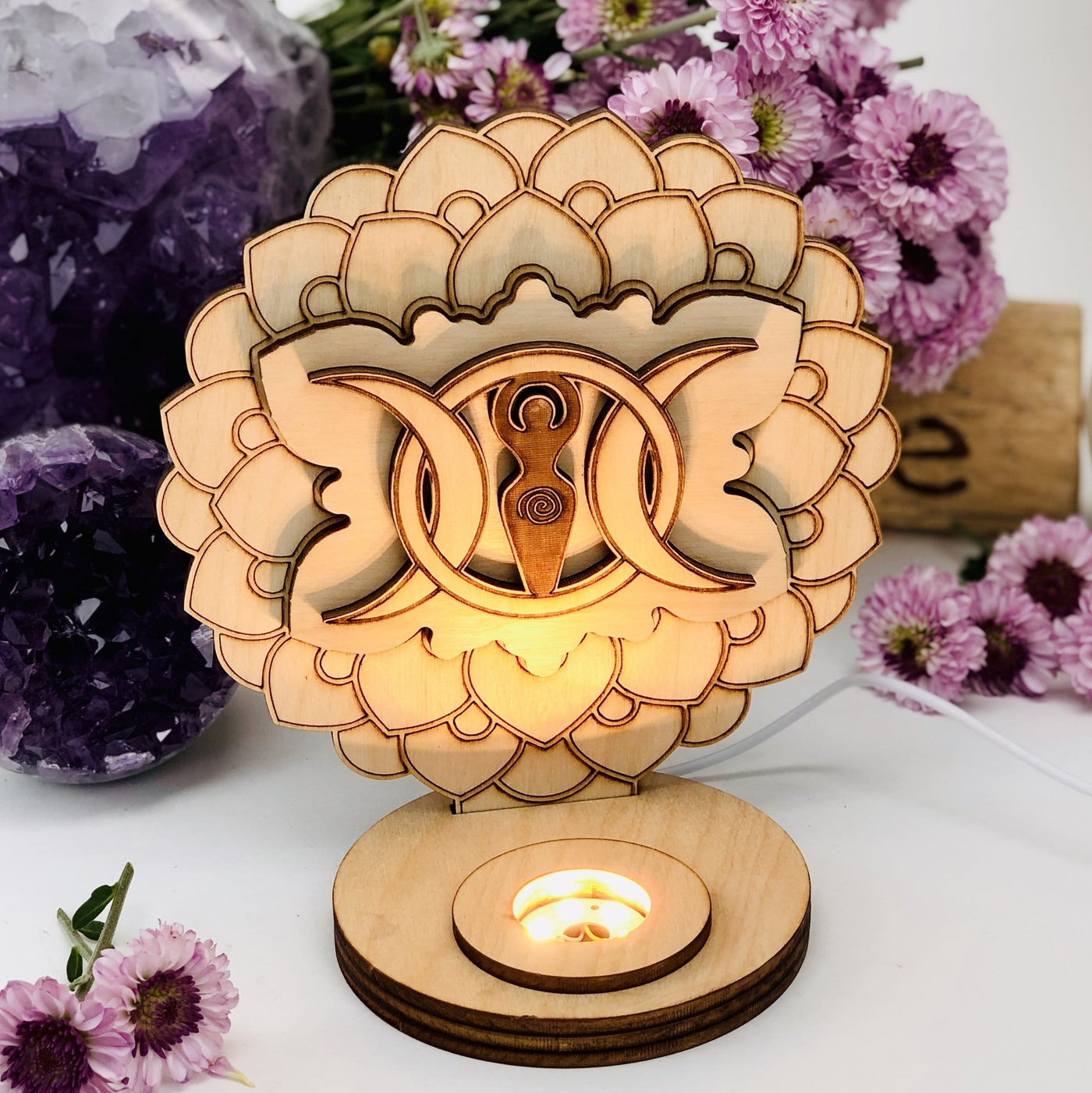 Earth Goddess and Moon Wooden Sphere Stand Lamp Sphere holder with flowers on a background
