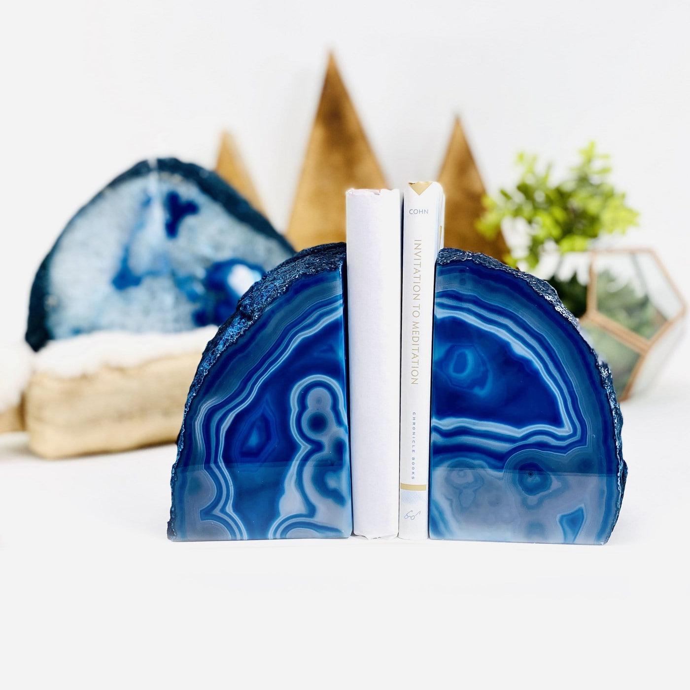 blue agate bookend with books in between