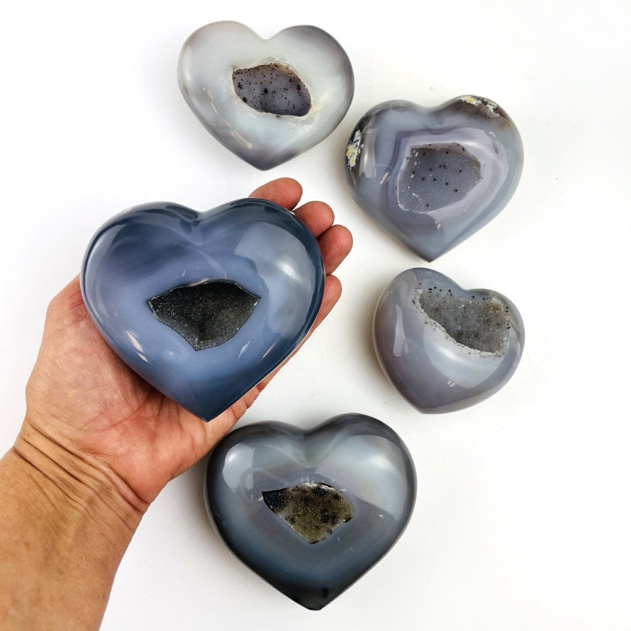 5 Agate Hearts with Druzy Centers , with one in a hand for size reference