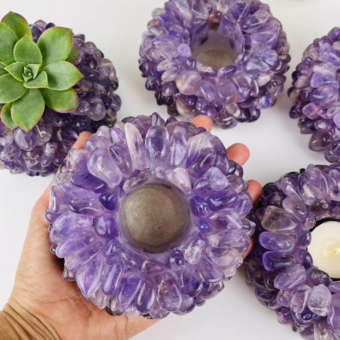 Amethyst Tumbled Crystal Candle Holders , one in a hand for size