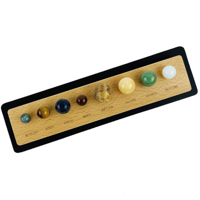 mat with the wood holder and stone spheres on it