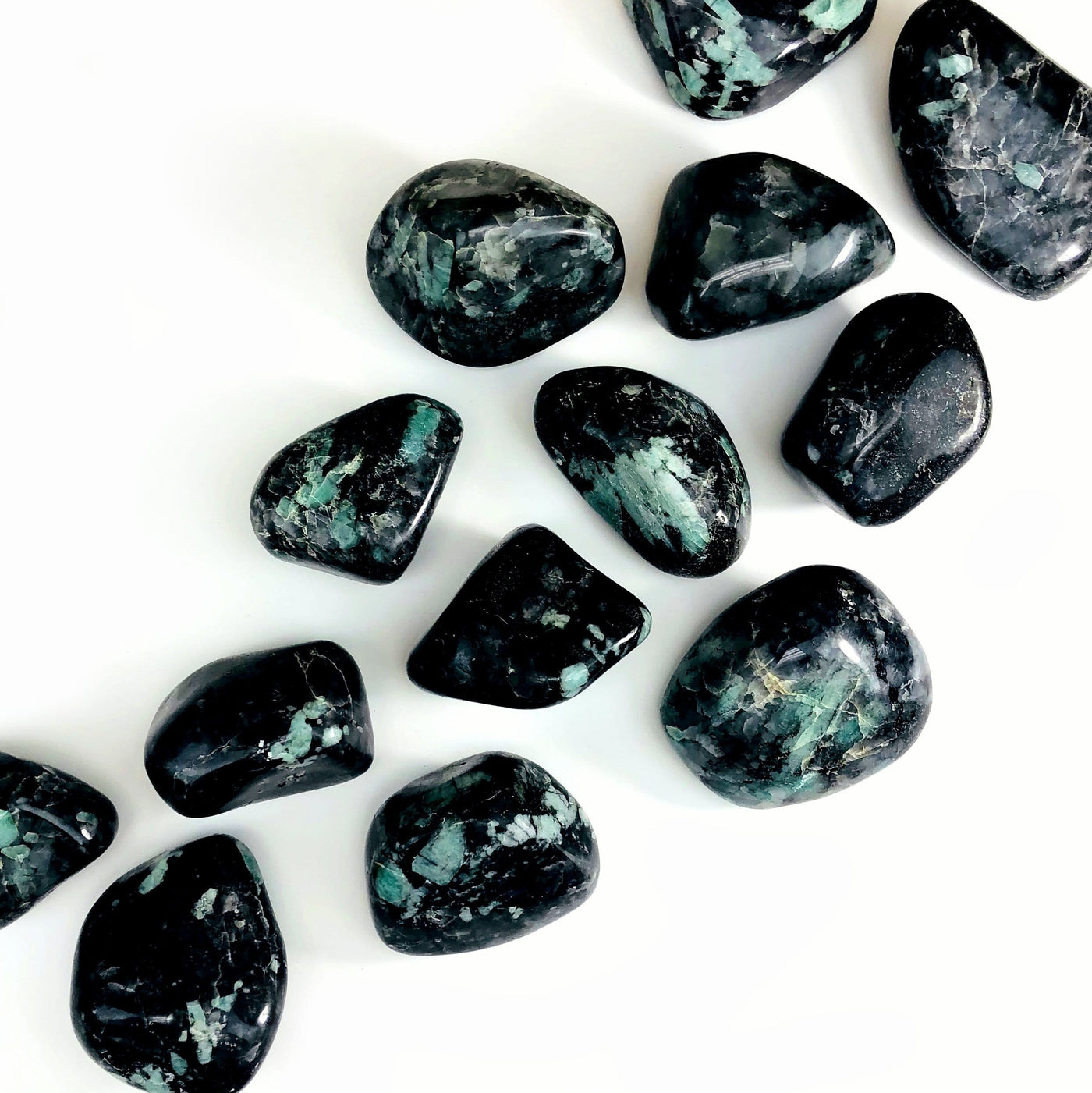 Emerald Freeform Tumbled Polished Stone line up showing different size 