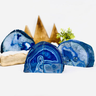 3 blue agate bookends on a table