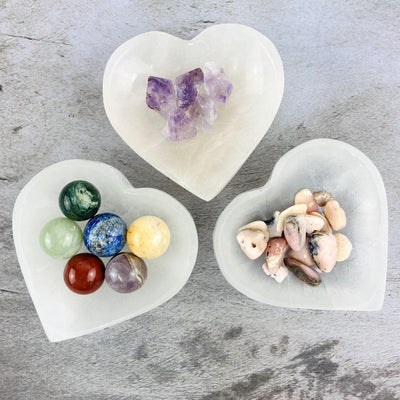 3 of the larger size Selenite Heart Bowls with stones inside