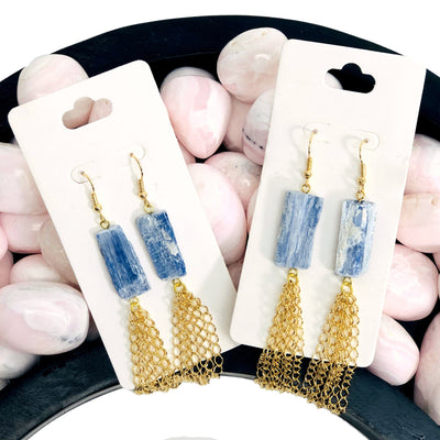 2 pairs of Blue Kyanite Dangle Earrings with Electroplated 24k gold tassels with decorations in the background