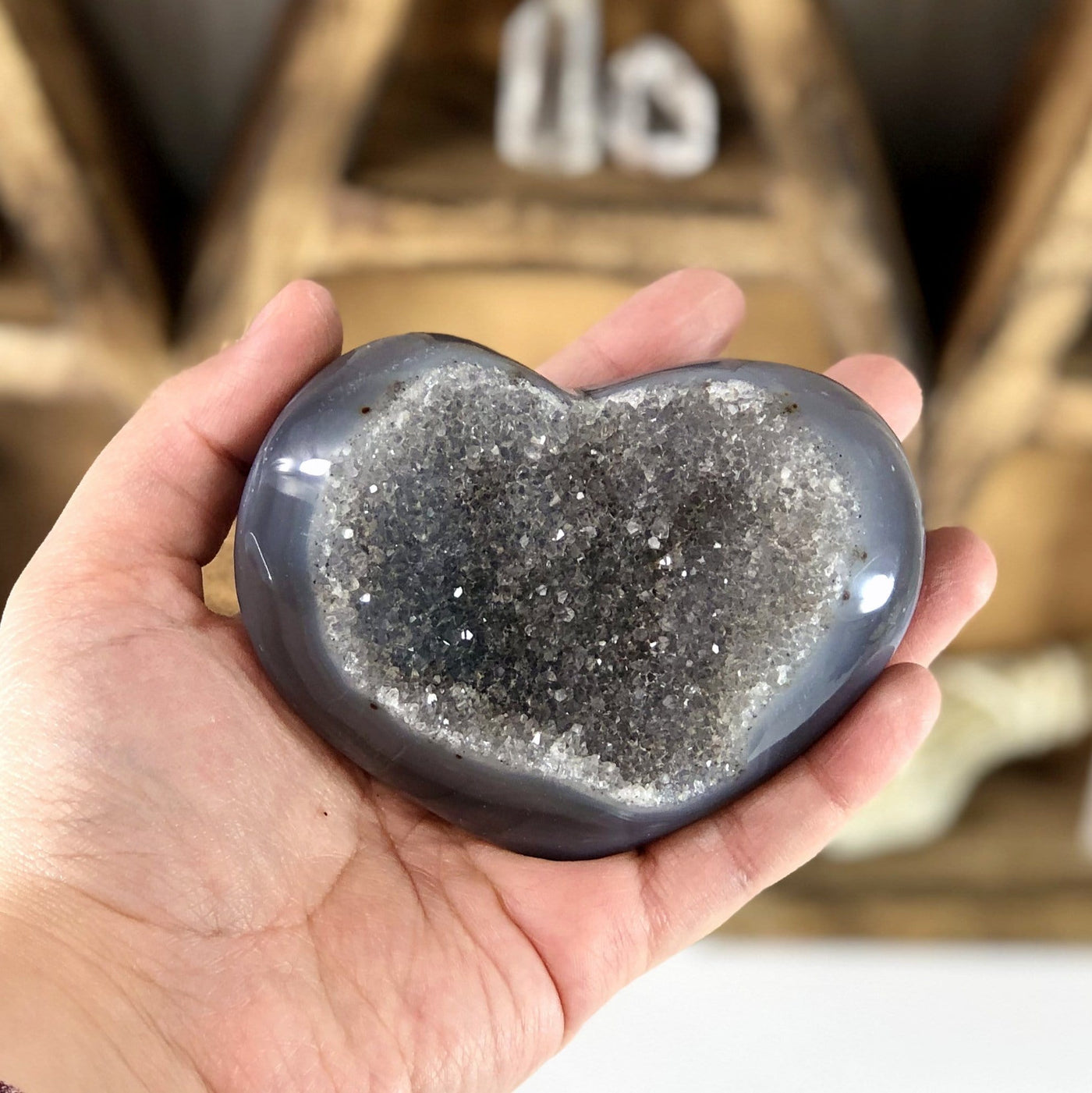 Front facing close up of Agate Druzy Heart (DOOAK-S24-27) in a hand.