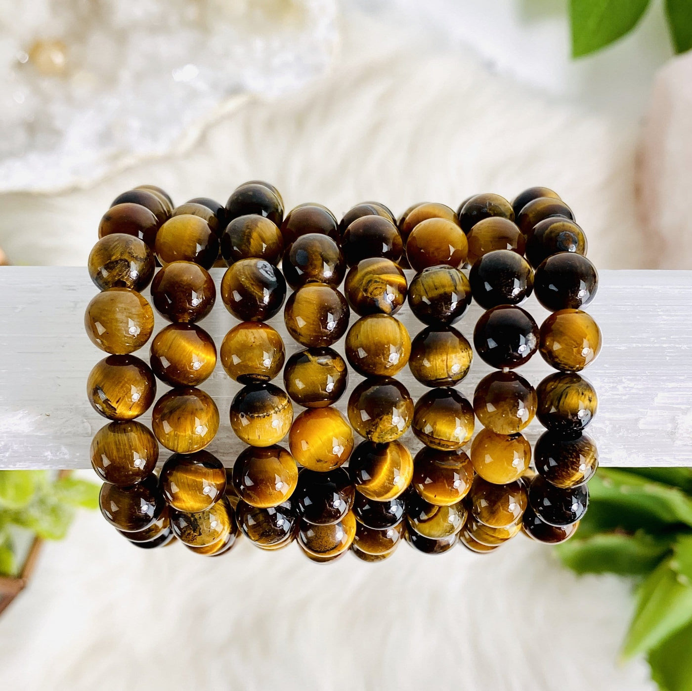 Tigers Eye Round Bead Bracelets 8mm. Tiger Eye has lovely bands of yellow-golden color through silky lusters of brown to red color. Tigers Eye is known as the “POWER STONE”. This is a powerful stone that aids harmony and balance, helping to release anxiety and fear.
