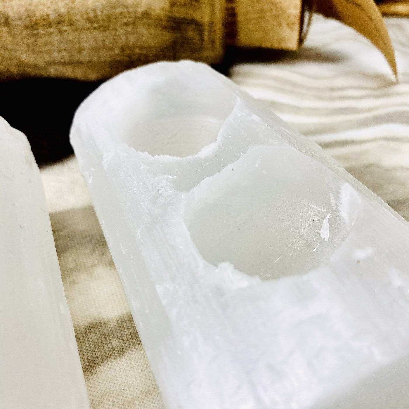 angled view of selenite log candle holder