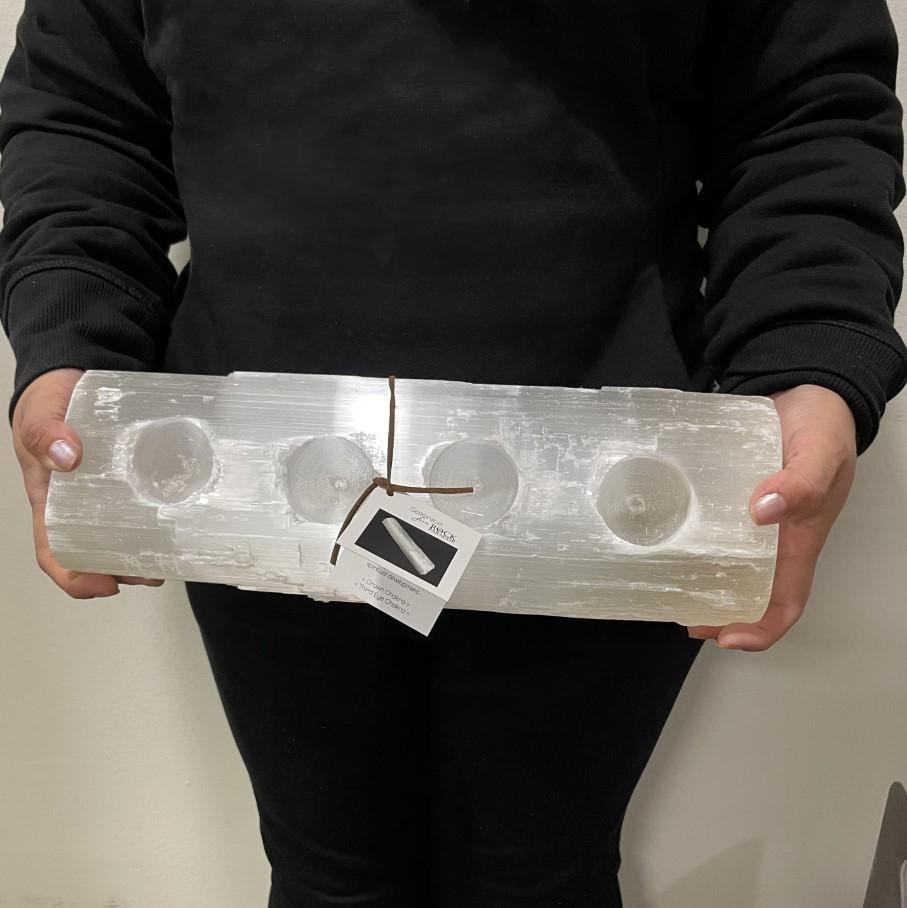4 votive selenite candle holder in hand for size reference