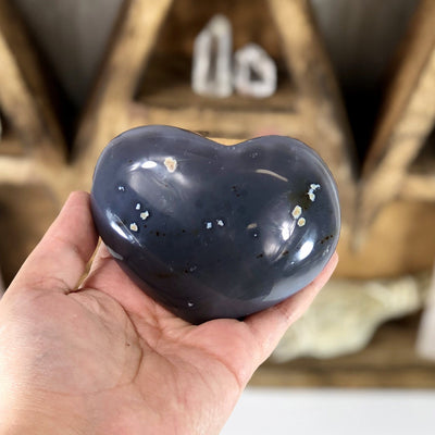 Back side view of Agate Druzy Heart (DOOAK-S24-27) in a hand.
