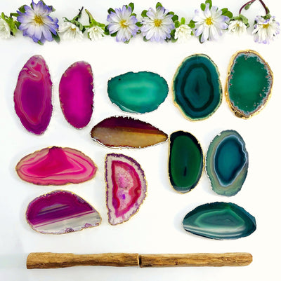 Picture of our Pink, green and natural agate slices on a white back ground.