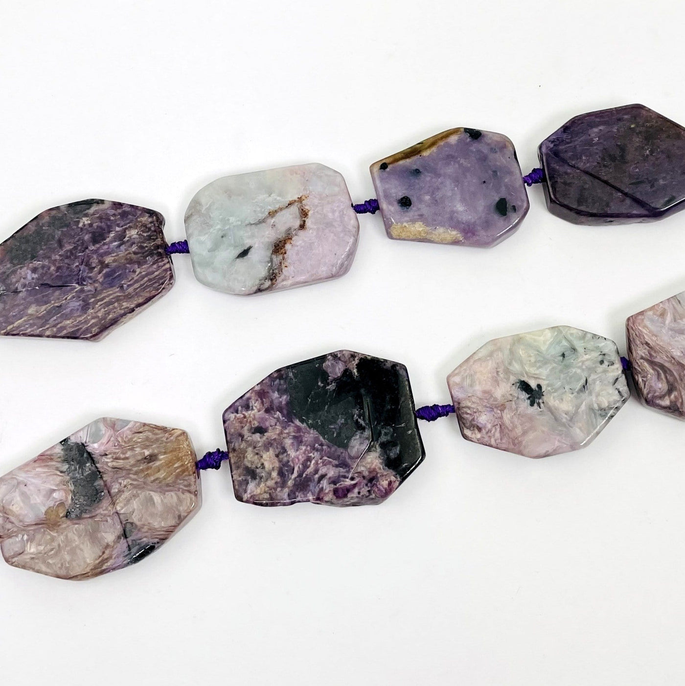 Charoite Slab Beads-dark and light colors with inclusions on flat surface. 