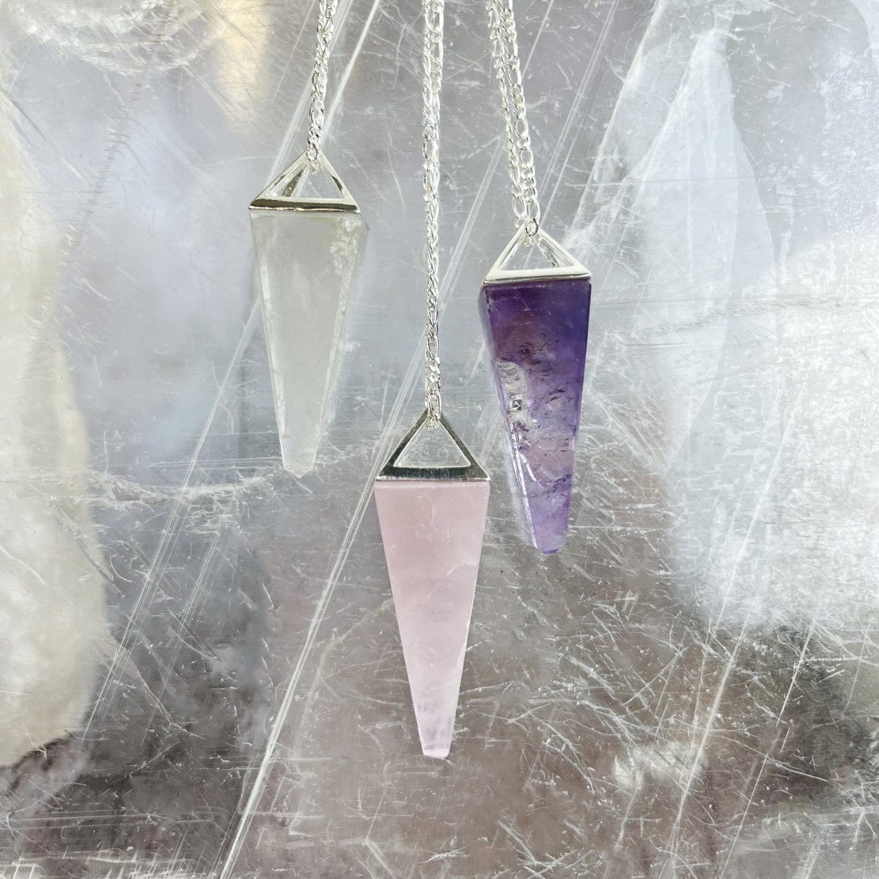 Rose Quartz Amethyst and Crystal Quartz Pendulum Necklaces in silver  upclose