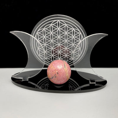 Close up of Acrylic Sphere Holder Crescent Moons with Flower of Life holding a sphere.