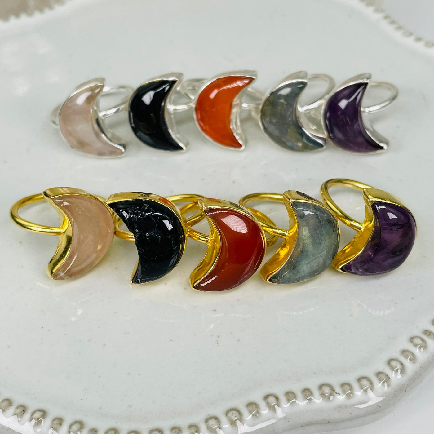 all rings in gold and silver displayed to show the differences in the gemstone types 