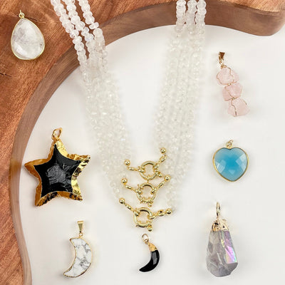 necklaces displayed with some candy necklace charms and pendants 
