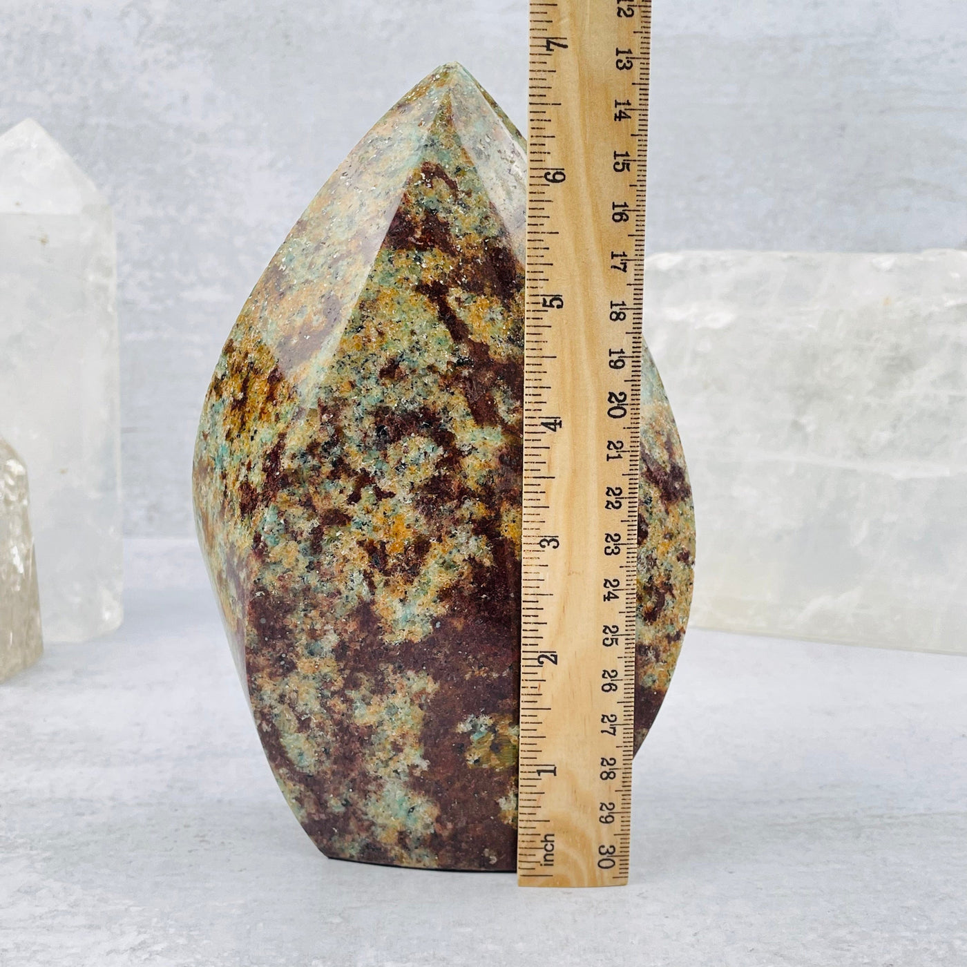Amazonite Polished Flame tower next to a ruler for size reference 