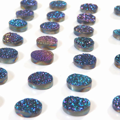 side view of the Titanium Coated Round Rainbow Druzy Cabochons for thickness reference