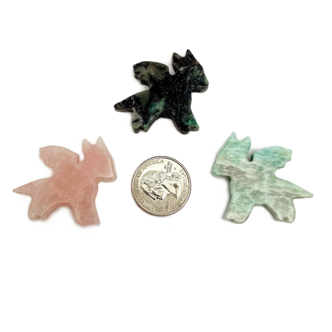 rose quartz emerald amazonite dragons next to quarter for size reference