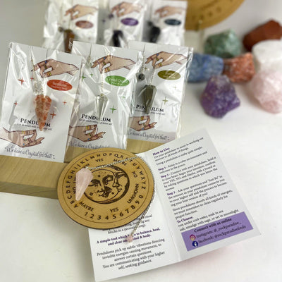 various crystal pendulums in packaging