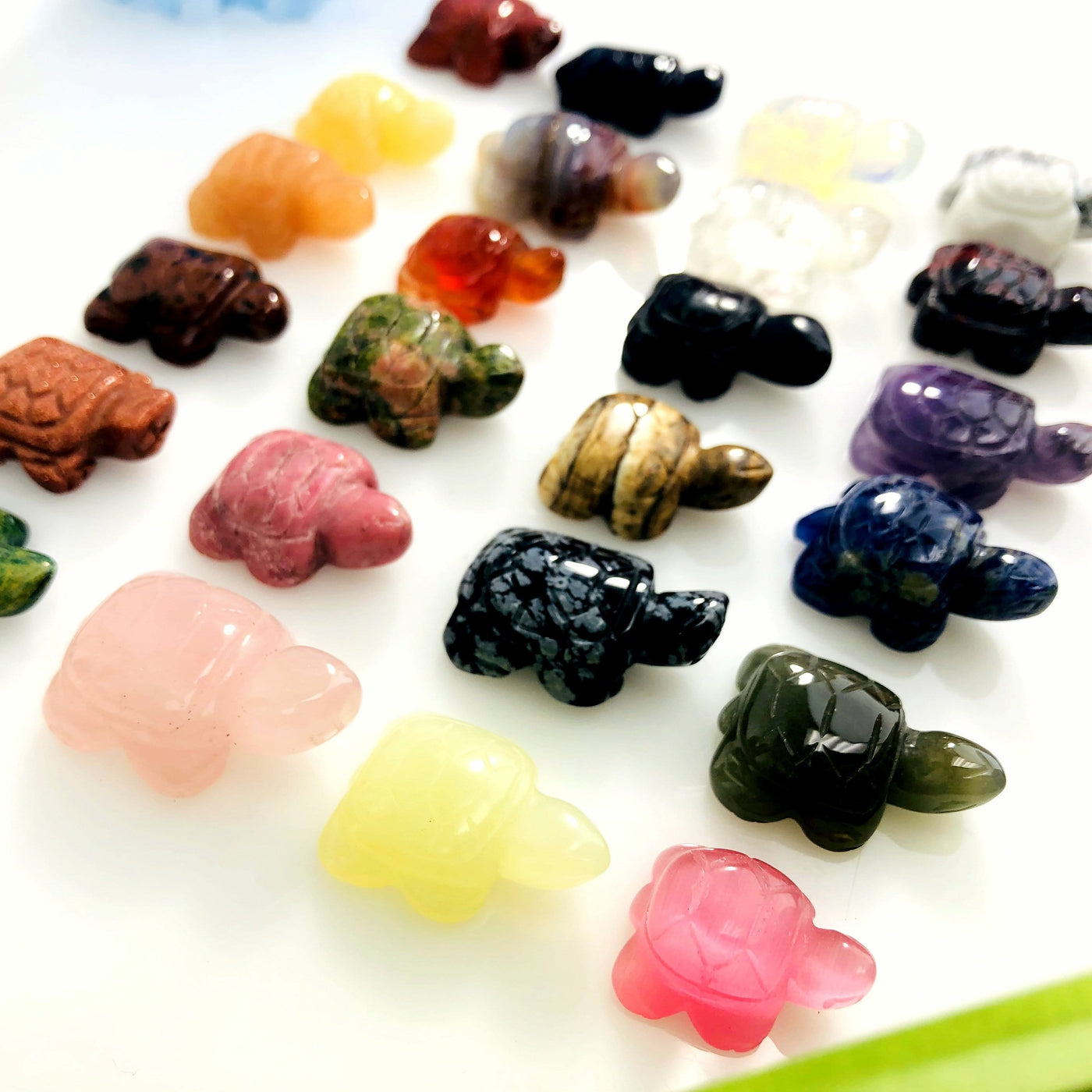 24 Small Assorted Turtle Gemstone Cabochons at an angle