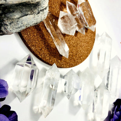 Crystal Quartz Double Terminated Points laid out on a table showing sizes