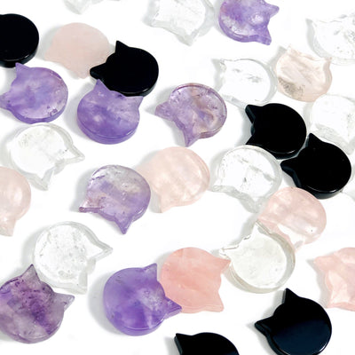 Gemstone Cats scattered on white background