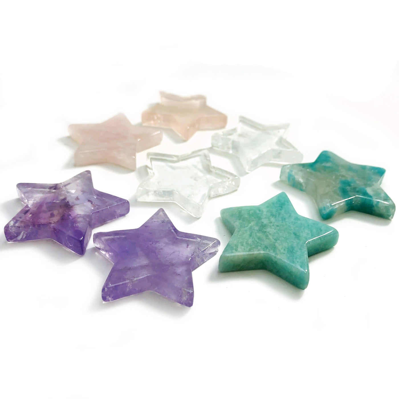 angled shot of 8 Products Gemstone Star Cabochons in different stones on white background