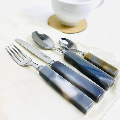 This is a picture of The set, Which comes with a Fork, Knife, Spoon and Tea Spoon.
