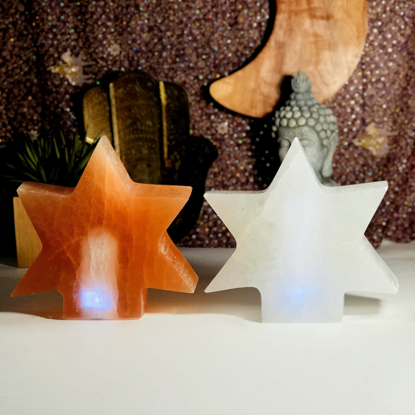 orange and white selenite lamps turned on in natural light