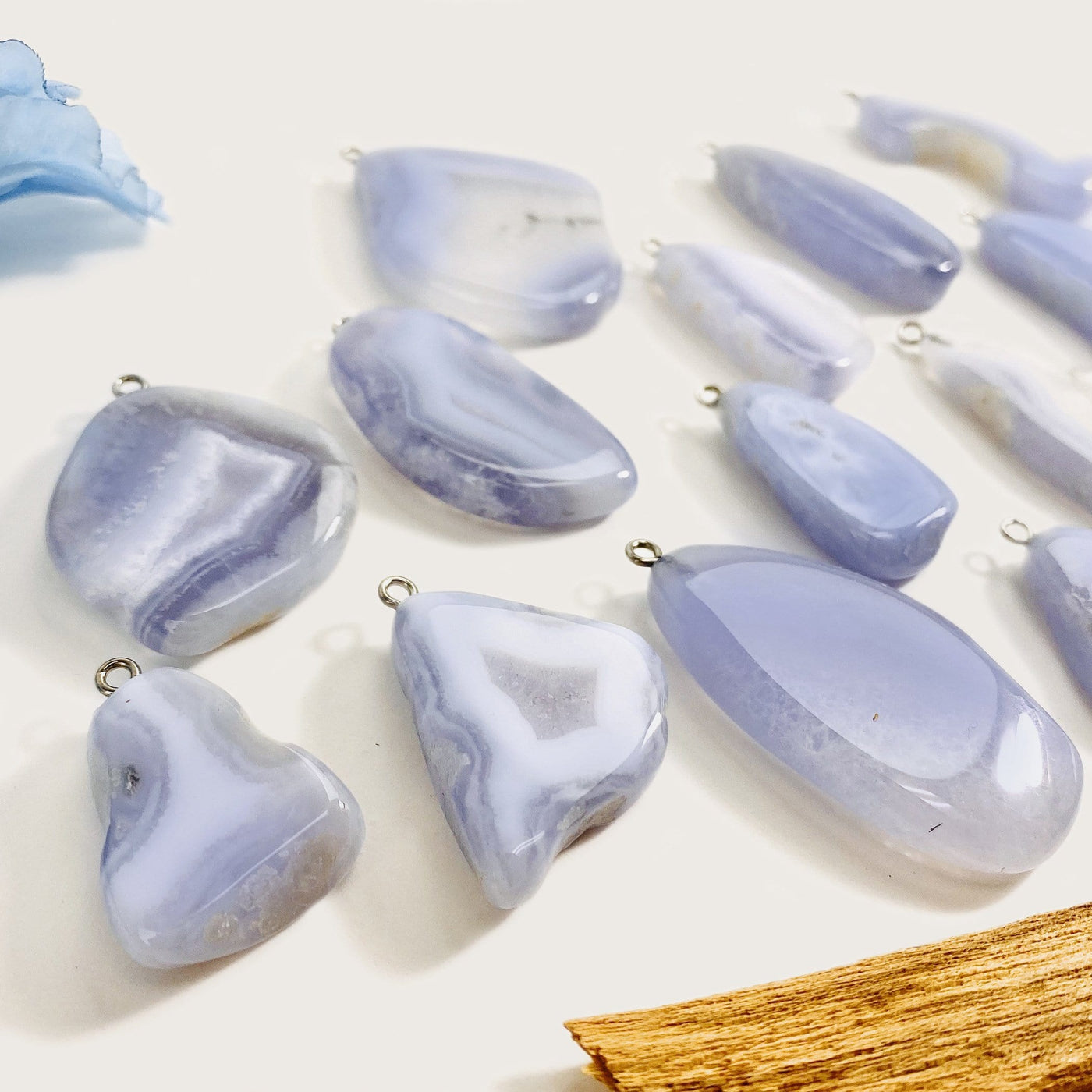 blue lace agate pendant displayed side view to show thickness variations